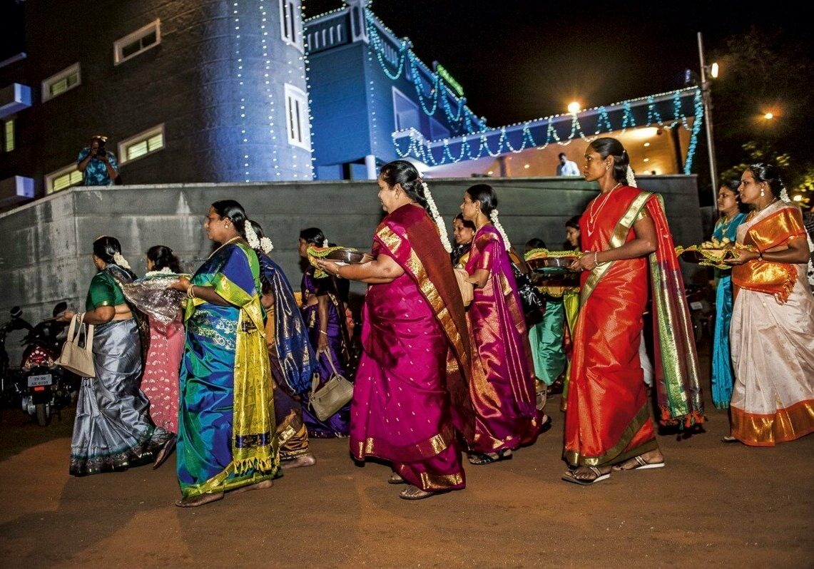 Women from the bridegroom's family bring gifts for the bride as part of the betrothal ceremony before a south Indian wedding at the holy city of Madurai. Tamil Nadu, 2009